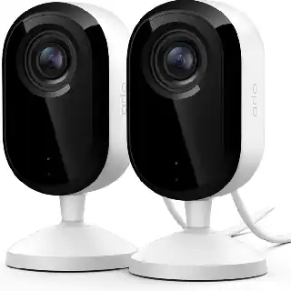 Arlo Essential indoor security cameras in white with black front panel, dual camera setup with 2K video, motion detection, and sleek modern design for home monitoring