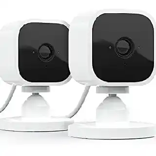 Blink Mini indoor security cameras in white with compact square design, dual camera setup with 1080p HD video, night vision, and motion detection for home monitoring