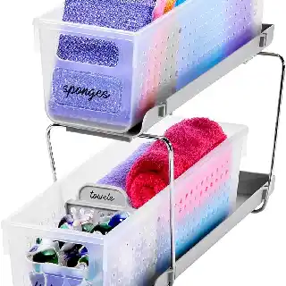 Madesmart mini two tier slide out organizer with clear storage bins holding cleaning supplies sponges towels and dish pods compact cabinet storage solution for kitchen and bathroom
